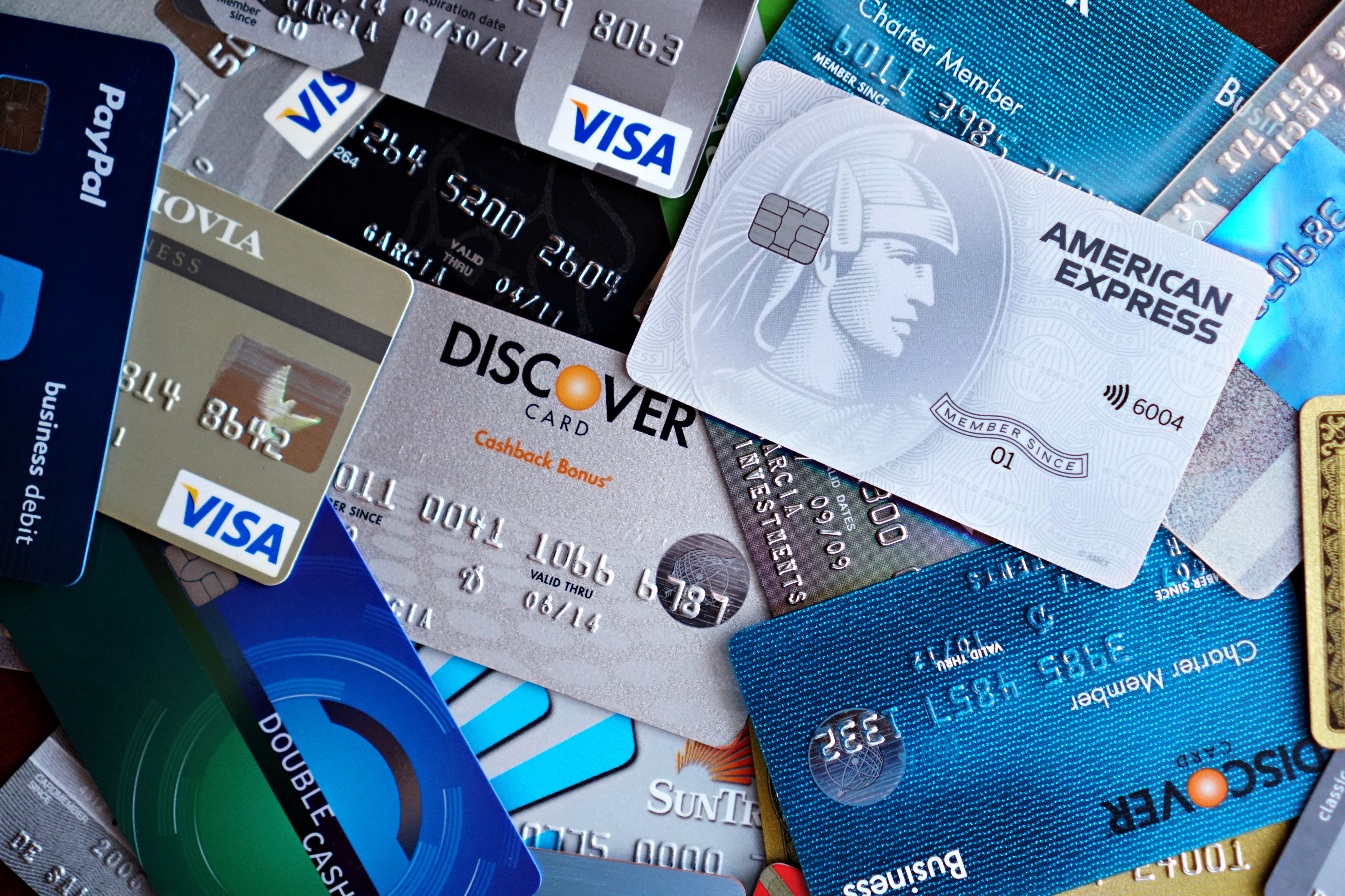 Close-up of various credit cards including Visa, Mastercard and American Express, symbolizing reckless spending
