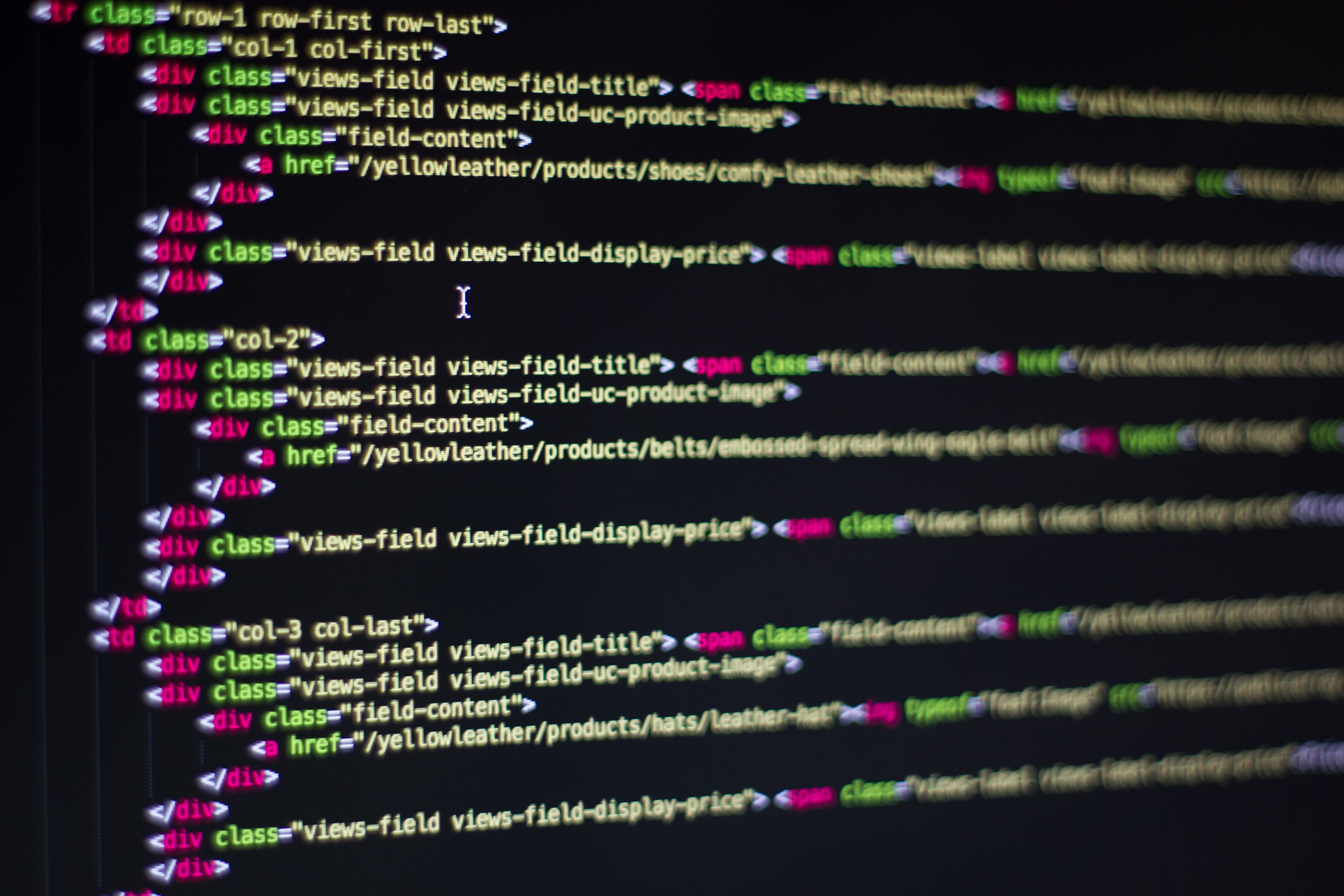 Close-up of HTML and CSS code on a monitor illustrating technical WordPress performance fixes
