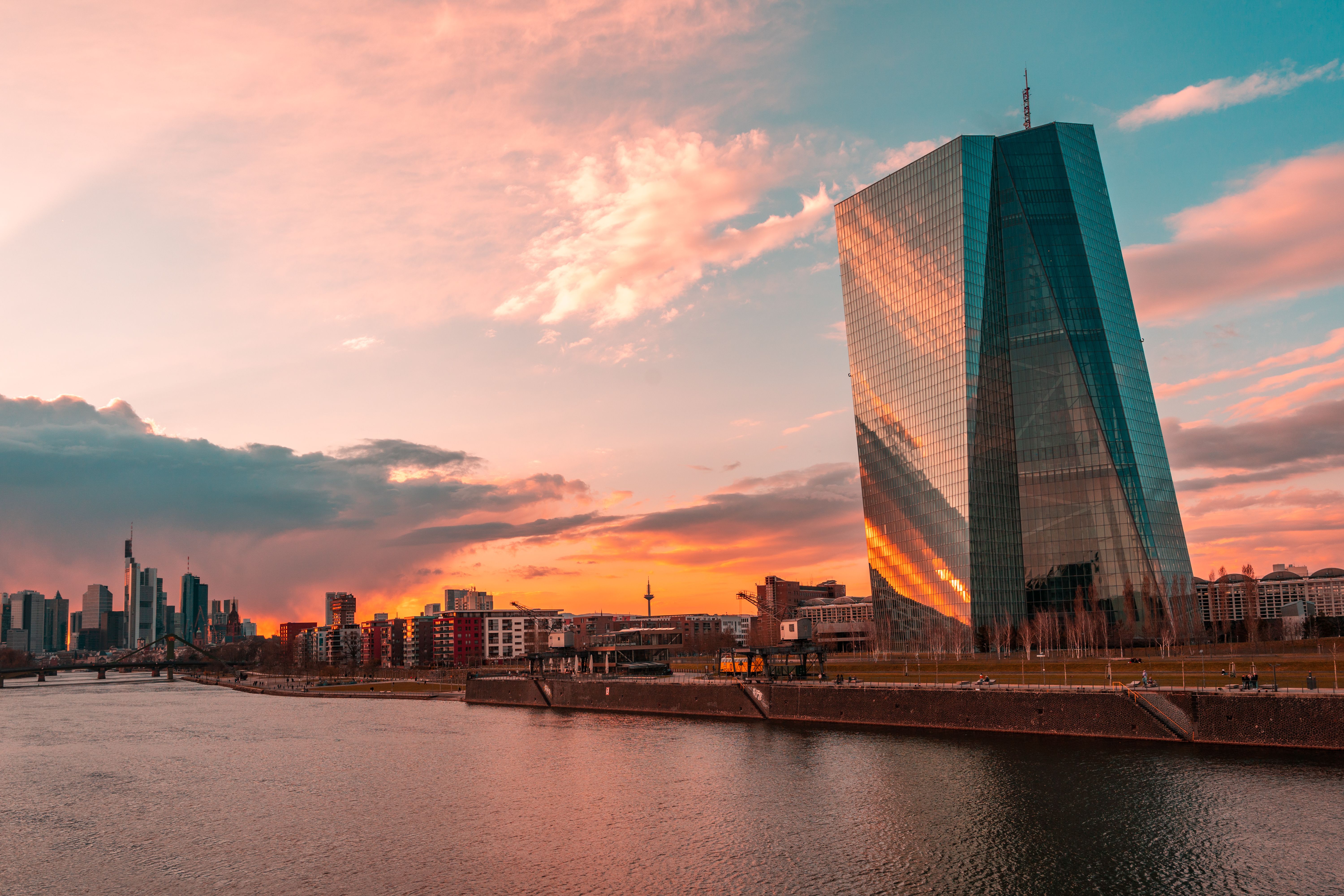 Sunset over Frankfurt skyline featuring the ECB Tower, symbolizing central bank policy